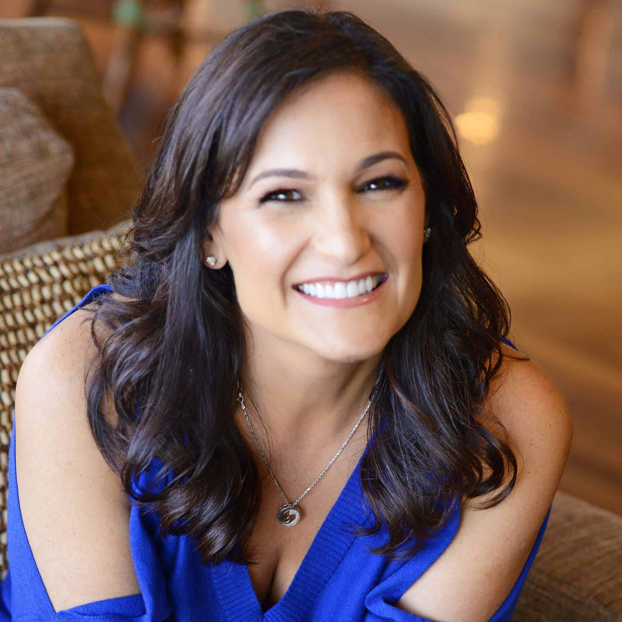Founder of Quantum Energy Coaching Academy Christy Whitman Wearing Blue Blouse
